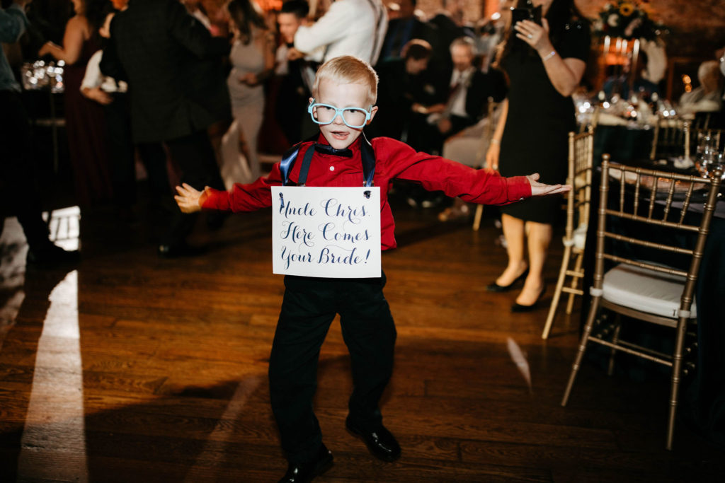 Nephew ring bearer with sign