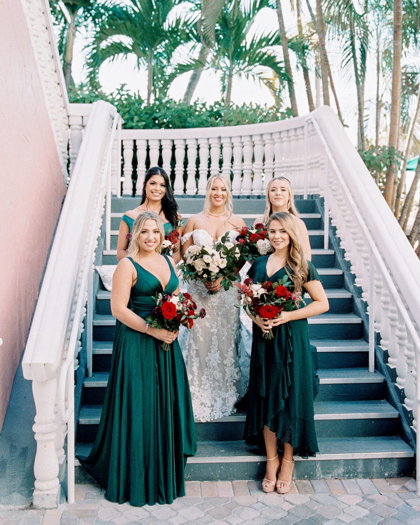 Wedding party and bridesmaids on the steps at the Don CeSar