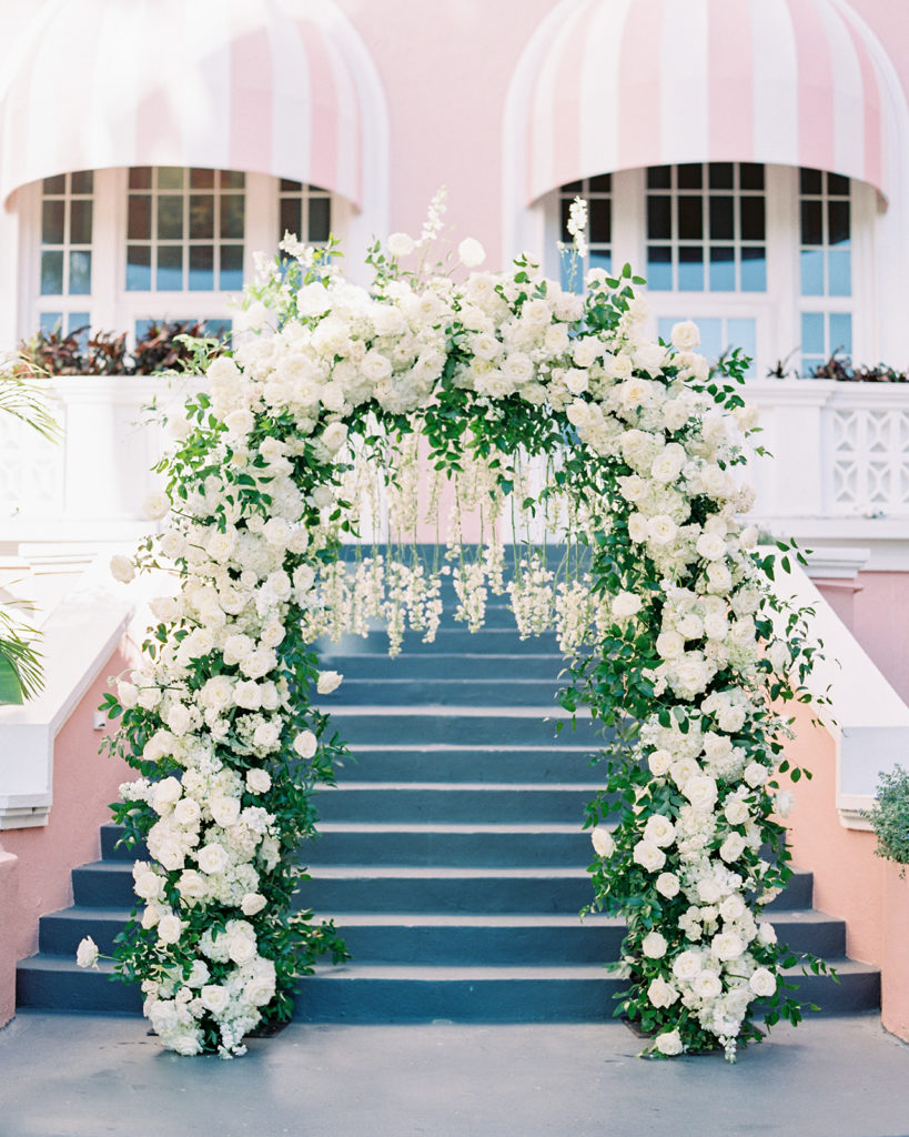 Luxury white floral wedding arch for wedding ceremony by 2Birds Events