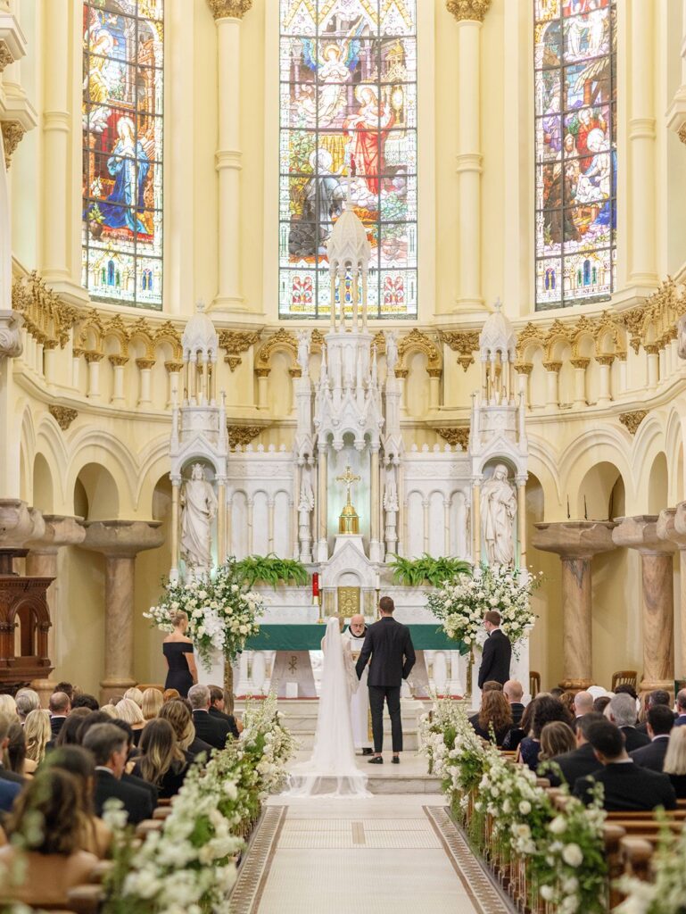 Luxury Sacred Heart Tampa wedding with pew flowers